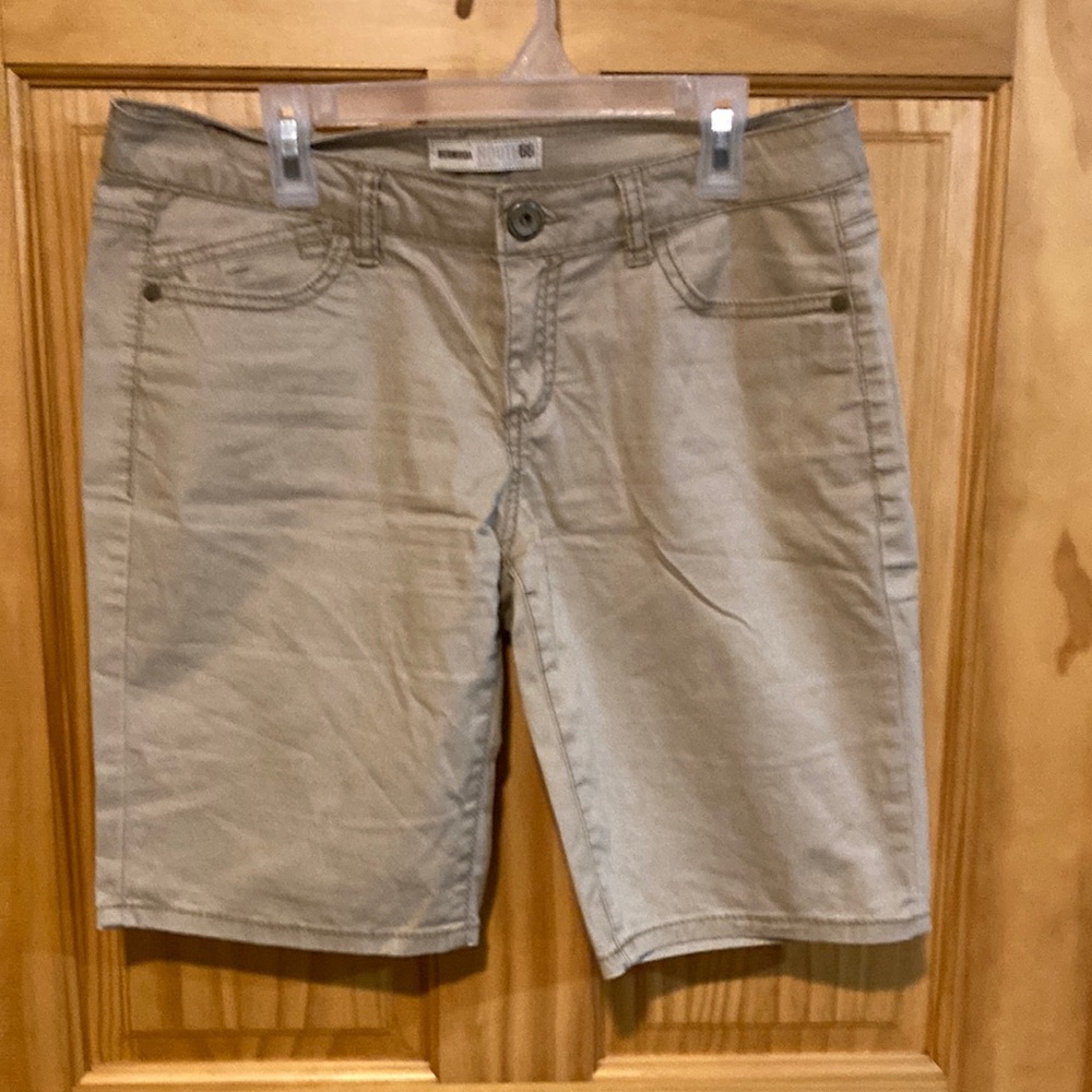 Women’s 2 pairs of cargo shorts. One tan color and one blue.